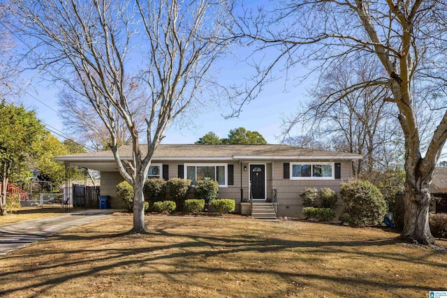 view of front of property with a front yard and a carport