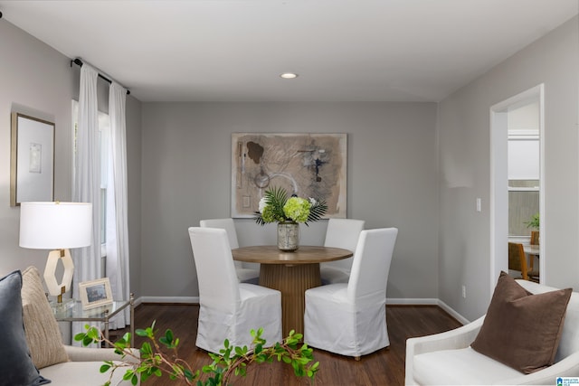 dining room with dark wood-type flooring