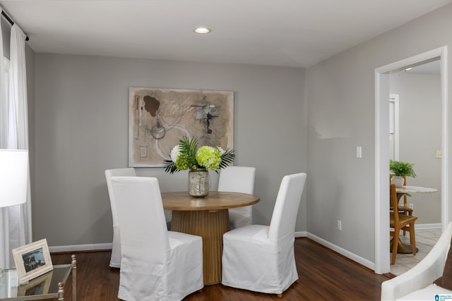 dining area featuring dark hardwood / wood-style flooring