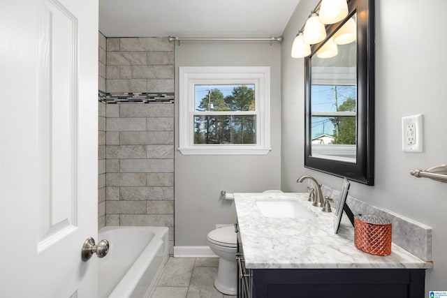 full bathroom with vanity, toilet, and tiled shower / bath combo