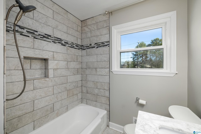 full bathroom featuring sink, toilet, and tiled shower / bath combo