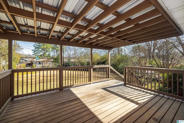 wooden deck with a lawn