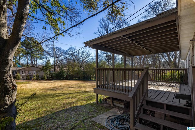 view of yard with a wooden deck