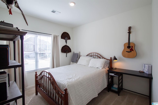 carpeted bedroom featuring multiple windows