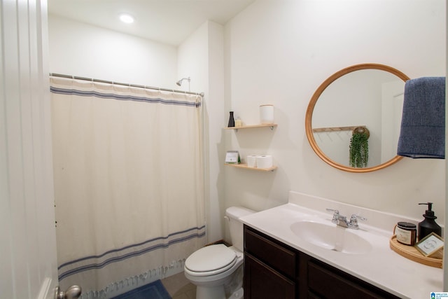 bathroom with a shower with curtain, vanity, and toilet