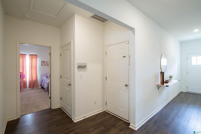 corridor featuring dark hardwood / wood-style flooring