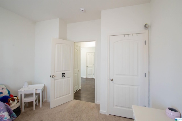 carpeted bedroom with a closet