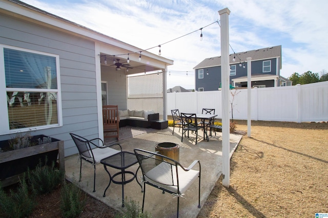 view of patio with outdoor lounge area and ceiling fan