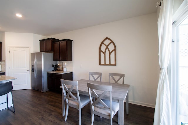 dining area featuring dark hardwood / wood-style flooring