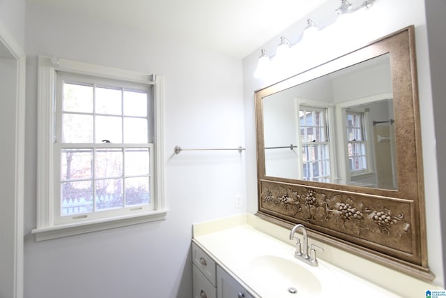 bathroom featuring a wealth of natural light and vanity