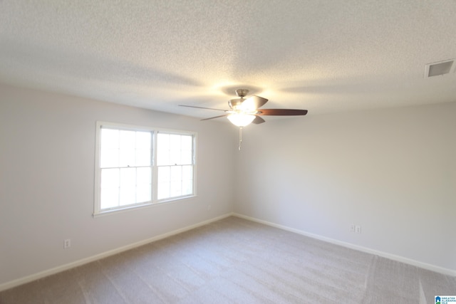 unfurnished room featuring ceiling fan and light colored carpet