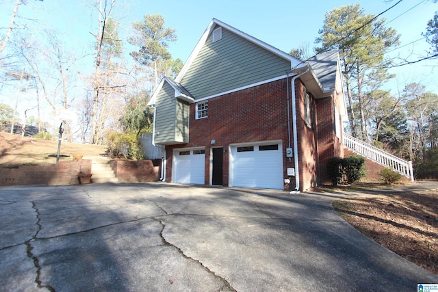 view of side of home with a garage