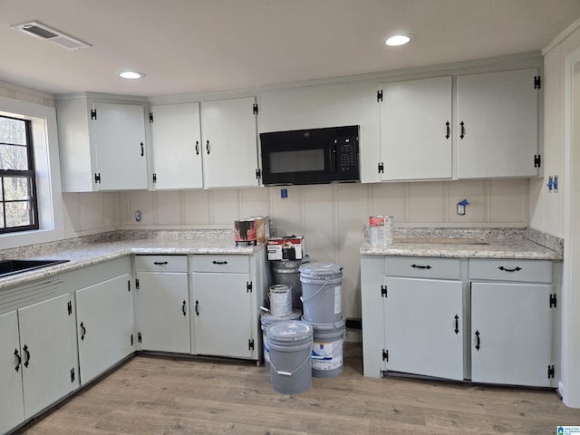 kitchen with white cabinetry