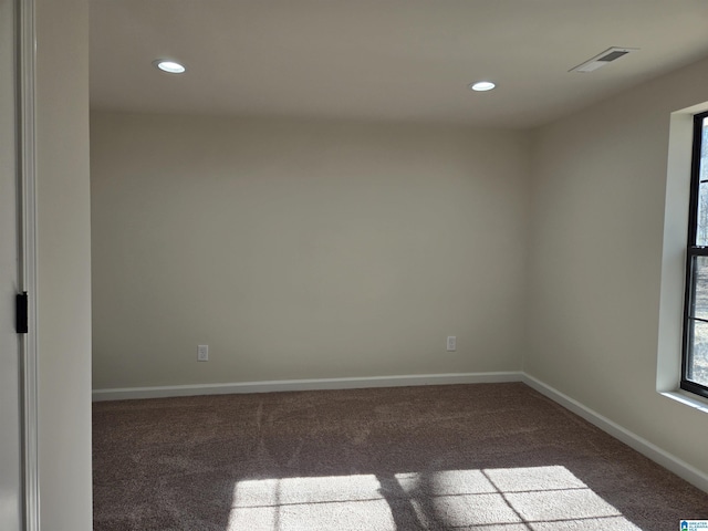 unfurnished room with carpet floors