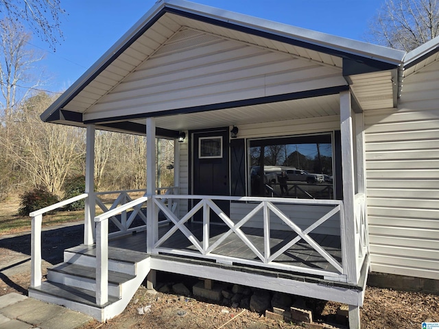 doorway to property featuring a porch