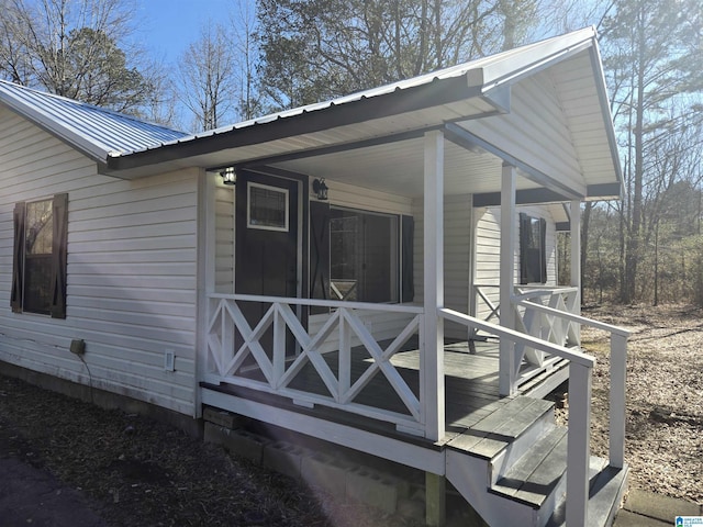 view of property exterior featuring covered porch