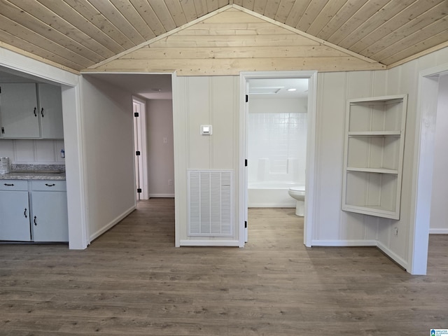 hall with hardwood / wood-style flooring, wooden ceiling, and vaulted ceiling