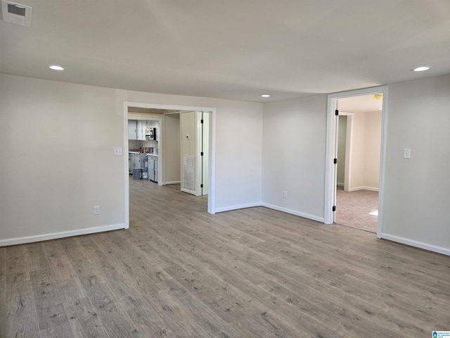 unfurnished room featuring light wood-type flooring