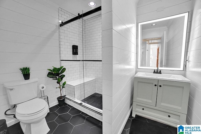 bathroom with toilet, vanity, ornamental molding, baseboard heating, and a shower with door