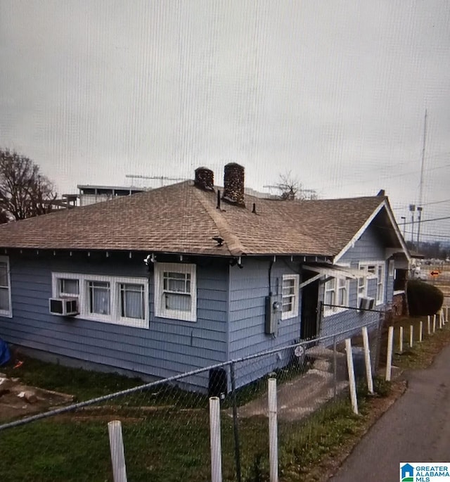 view of home's exterior with cooling unit