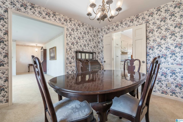 carpeted dining area with a notable chandelier