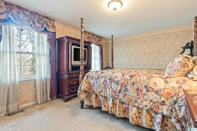 bedroom featuring light colored carpet