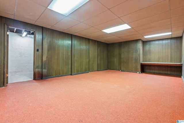 basement with carpet floors and a drop ceiling