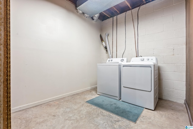 clothes washing area with washer and dryer