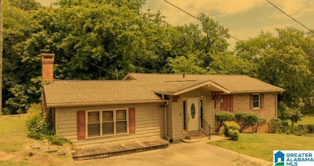 ranch-style house with a yard