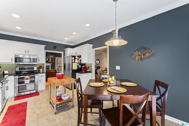 dining area with crown molding