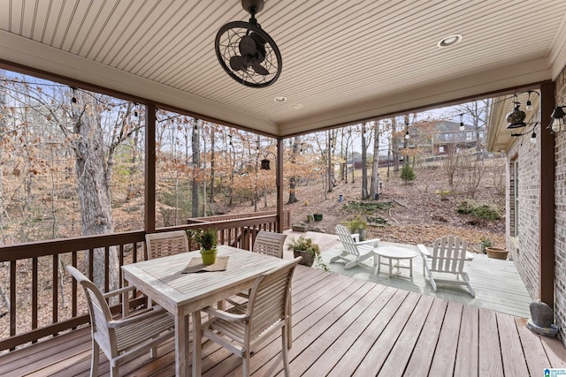 wooden deck featuring ceiling fan