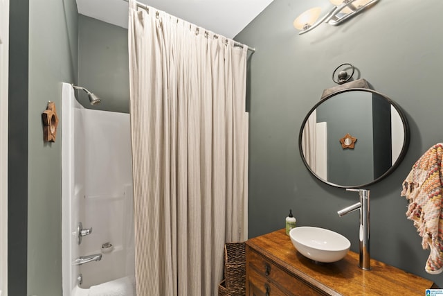 bathroom featuring vanity and shower / tub combo with curtain