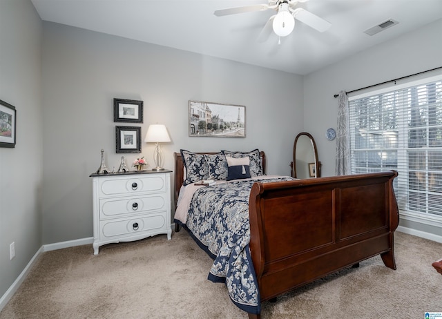 bedroom with ceiling fan and light colored carpet