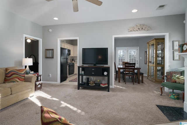 living room with light carpet and ceiling fan