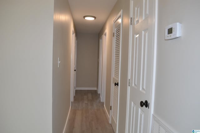 corridor featuring light hardwood / wood-style flooring