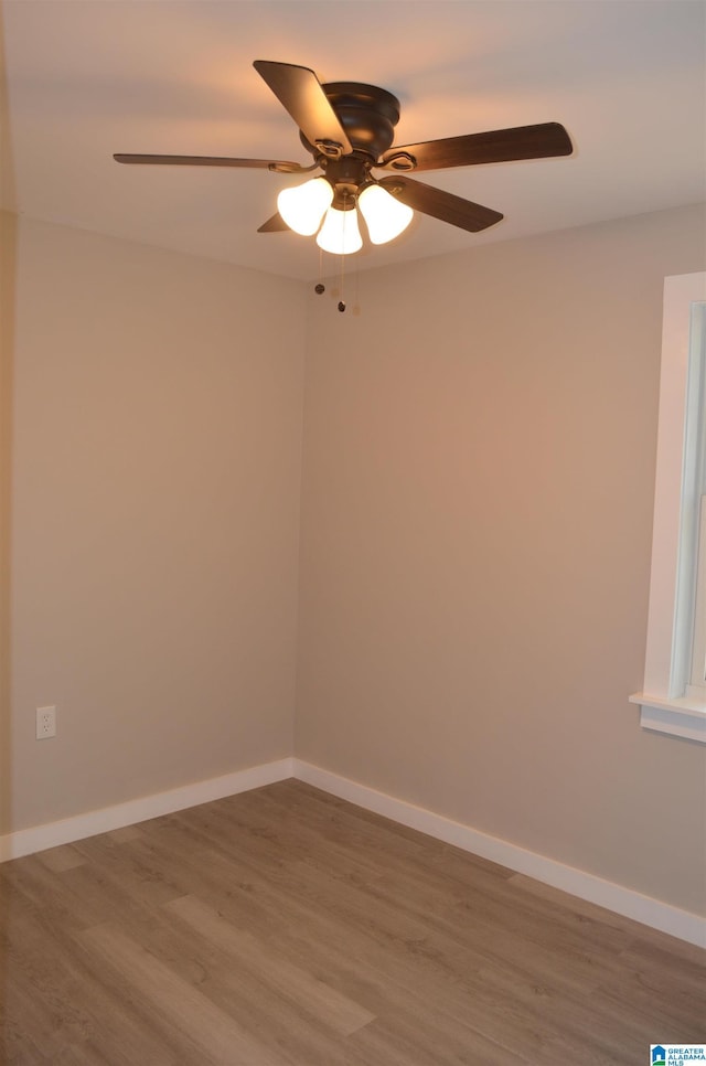 empty room with hardwood / wood-style flooring