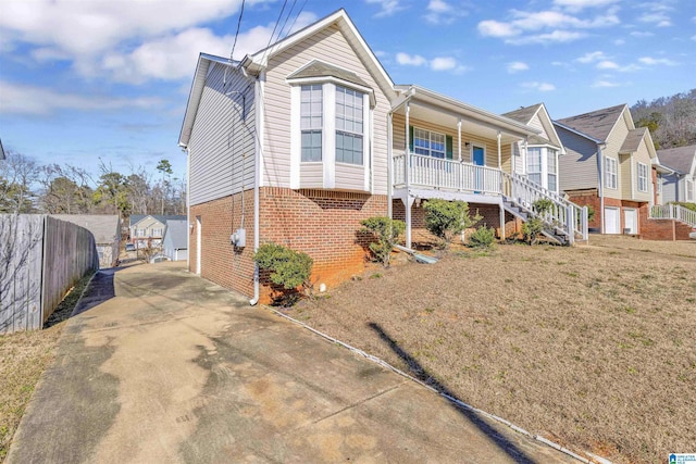 view of front facade with a front yard and a porch