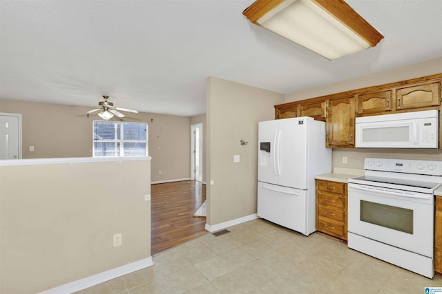 kitchen with ceiling fan and white appliances