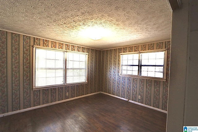 spare room with wood-type flooring