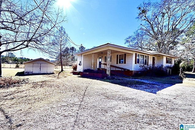 view of front facade with a storage unit