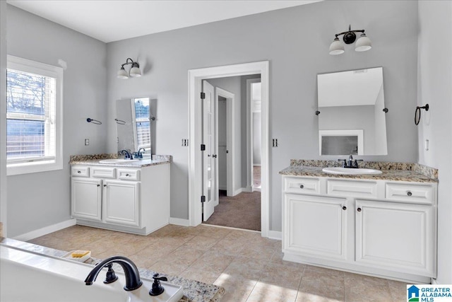 bathroom featuring tile patterned flooring and vanity