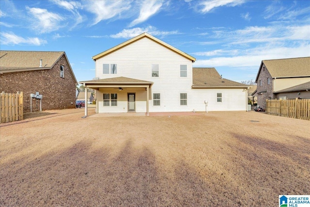 rear view of property with a patio area and ceiling fan