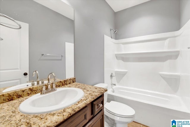 full bathroom with shower / bathing tub combination, vanity, and toilet