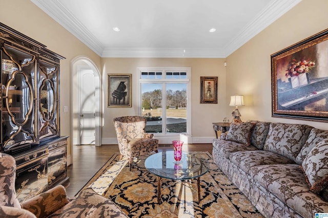 living room with dark wood-type flooring and crown molding