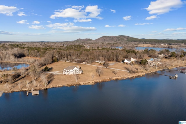 aerial view featuring a water and mountain view