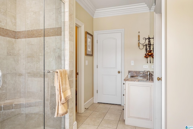 bathroom featuring a shower with shower door, vanity, tile patterned flooring, and ornamental molding