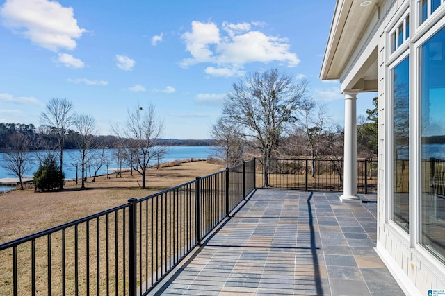 balcony featuring a water view