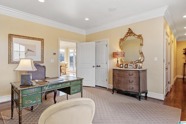 home office with crown molding and hardwood / wood-style floors