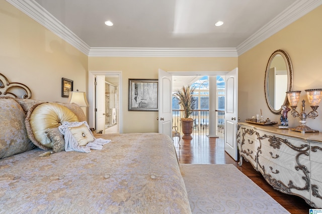 bedroom with access to exterior, dark wood-type flooring, crown molding, and connected bathroom