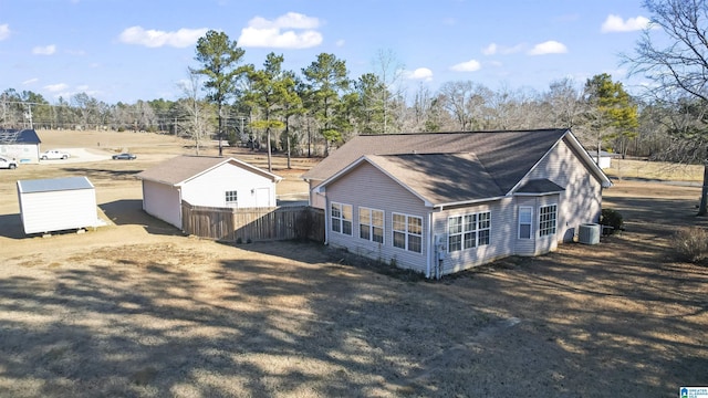 rear view of property featuring central air condition unit